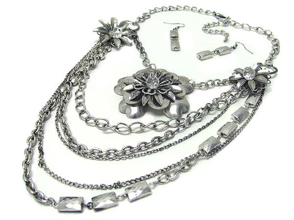 Multi layered chain and flower accent necklace earring set