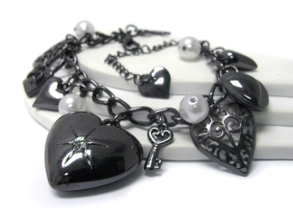 Multi puff metal heart and key bracelet