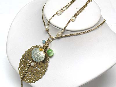 Metal filigree and shell charm drop long necklace and earring set