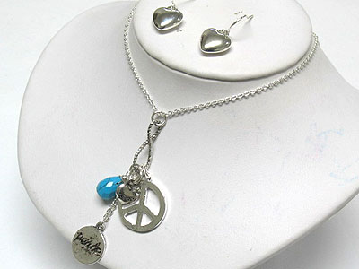 Peace theme charm and turquoise dangle necklace and earring set