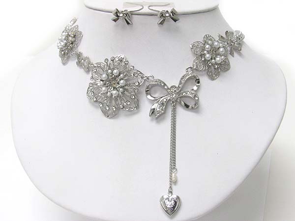 Crystal stud flowerr and ribbon link necklace earring set