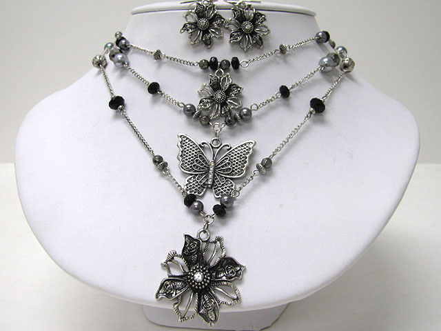 Metal butterfly and flower dangle triple layer necklace earring set