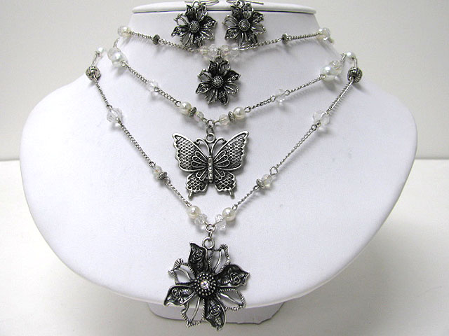 Metal butterfly and flower dangle triple layer necklace earring set