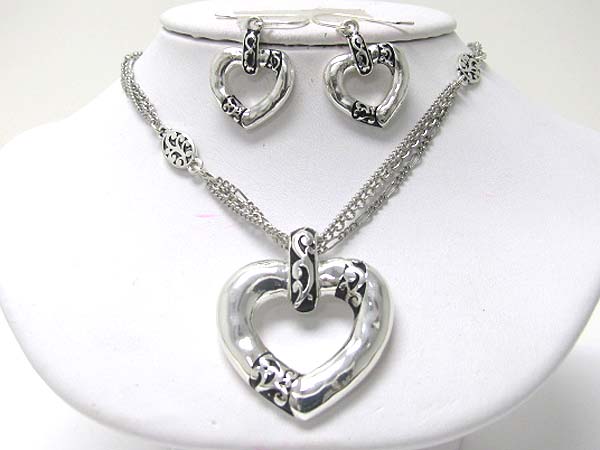 Textured and hammered metal heart pendant necklace earring set