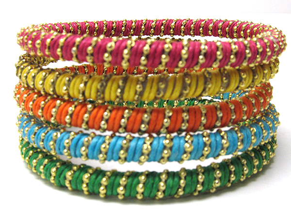 Multi row wood and small metal balls on fabric wrapped bangle set