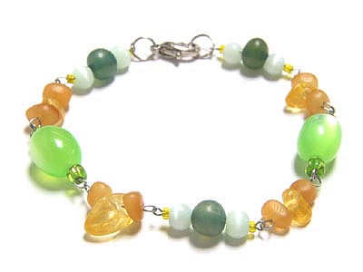 Hand made jewelry cats eye oval beads - golden carahorn nuggets - resin nuggets bracelet