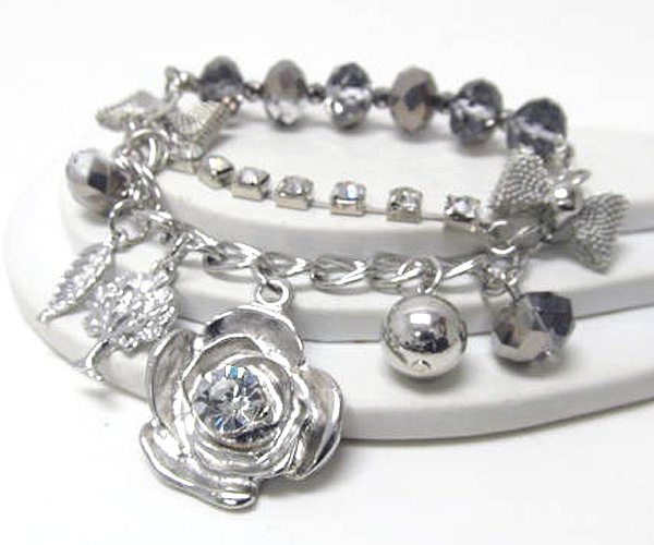 Crystal center metal flower and multi charm stretch bracelet