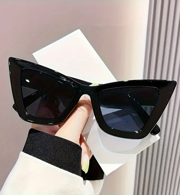 Bold black cat-eye sunglasses with sleek dark tinted lenses