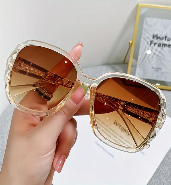 Elegant oversized square sunglasses with clear frames and gradient lenses