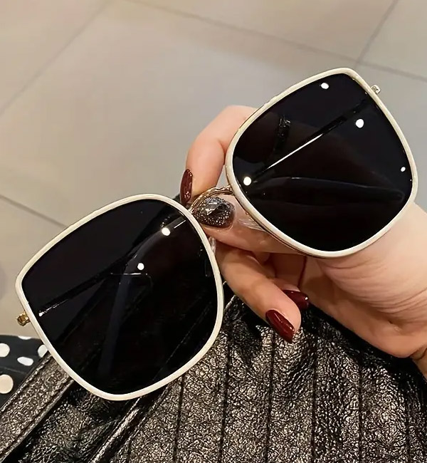 Modern oversized square sunglasses with white frames and dark lenses