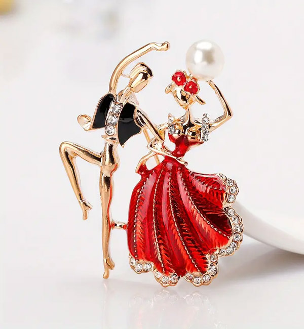 Dancing couple brooch with red dress and pearl detail, elegant