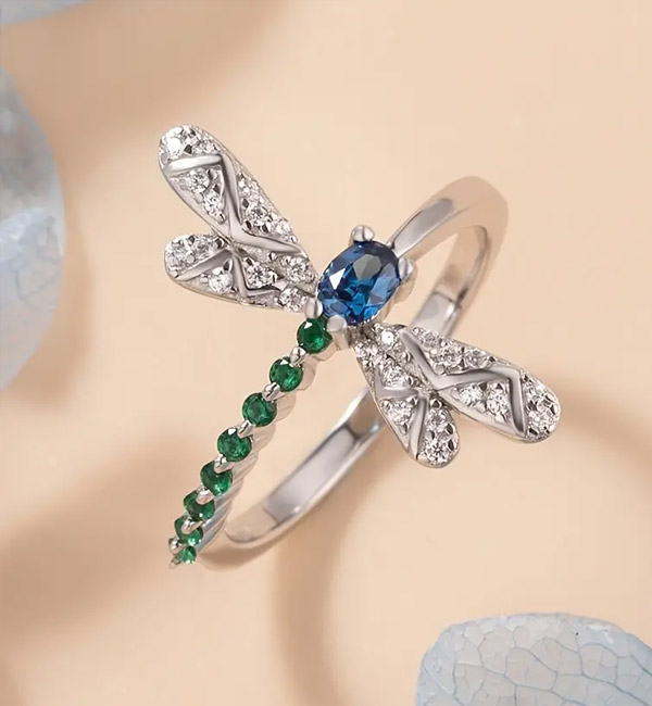Dragonfly ring with blue and green gemstones, elegant design