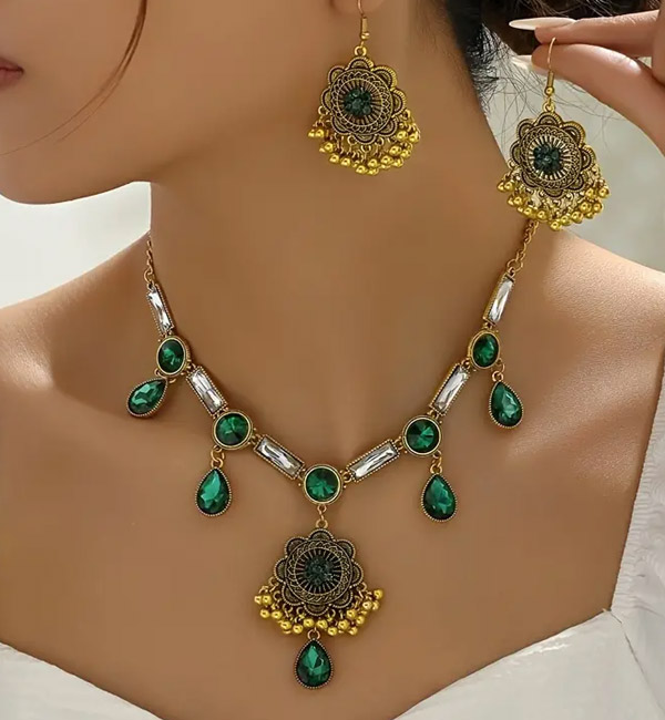 Elegant green gemstone necklace and earrings with vintage intricate designs party set