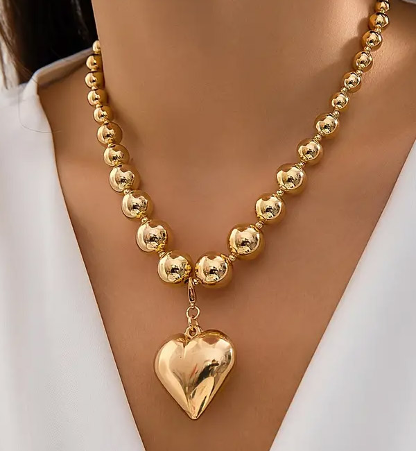 Elegant metal bead necklace with heart pendant