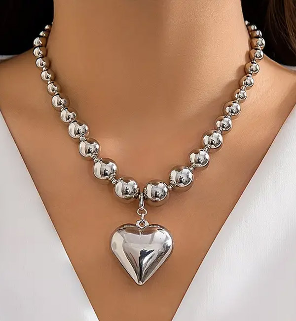 Elegant metal bead necklace with heart pendant