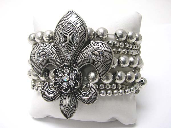 Crystal stud fleur de lis top multi row metal stretch bracelet