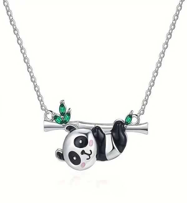 Cute panda necklace hanging from branch with leaves