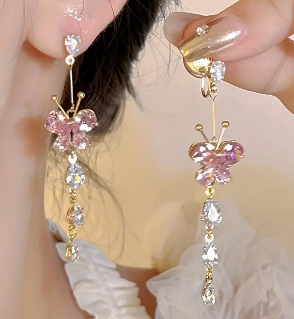 Sparkling pink butterfly earrings with dangling crystals