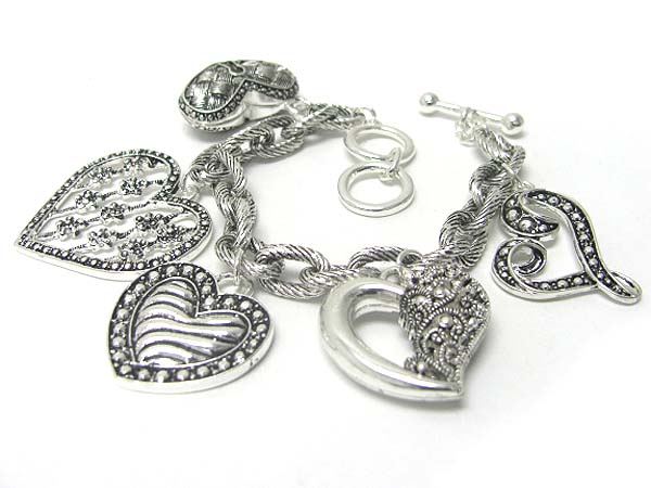 Multi textured metal heart charm dangle bracelet