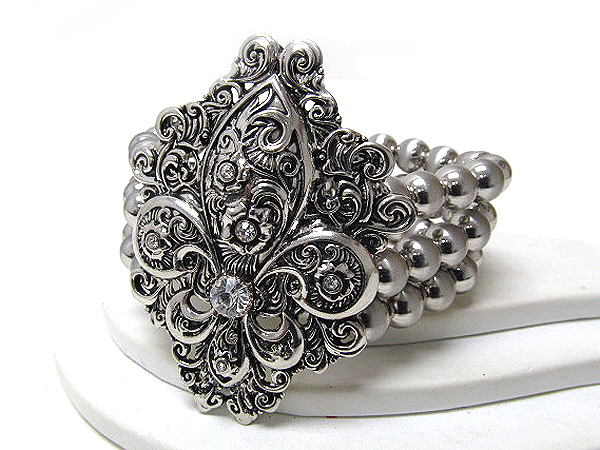 Crystal large filigree fluer de lis and multi metal balls stretch bracelet