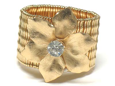 Crystal centered  scratch metal flower wide stretch bracelet - brass metal