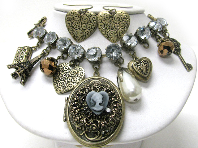 Retro vintage style locket and mixed charm with crystal accent necklace earring set