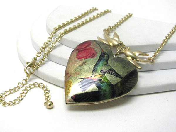 Antique style bird paint on a puff heart long necklace