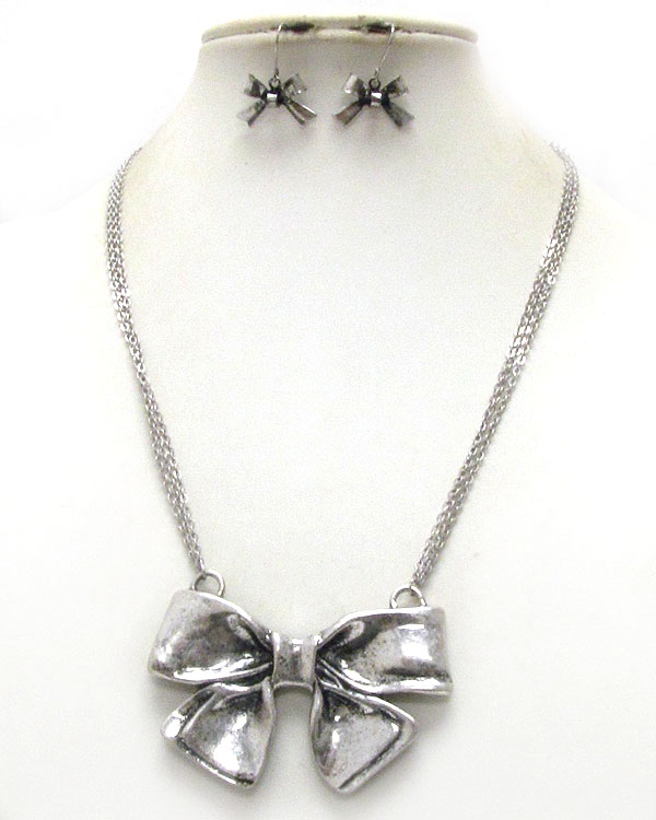 Metal ribbon pendant necklace earring set