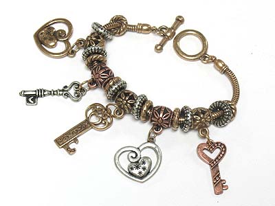 Key charm tri tone antique metal beads toggle bracelet