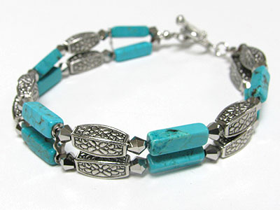 Double line turquoise and metal bar toggle braceelt