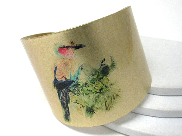 Antique style bird paint on a metal bracelet