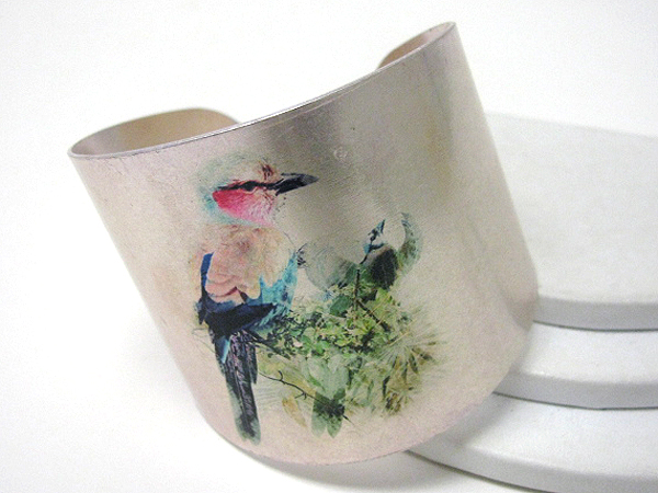 Antique style bird paint on a metal bracelet