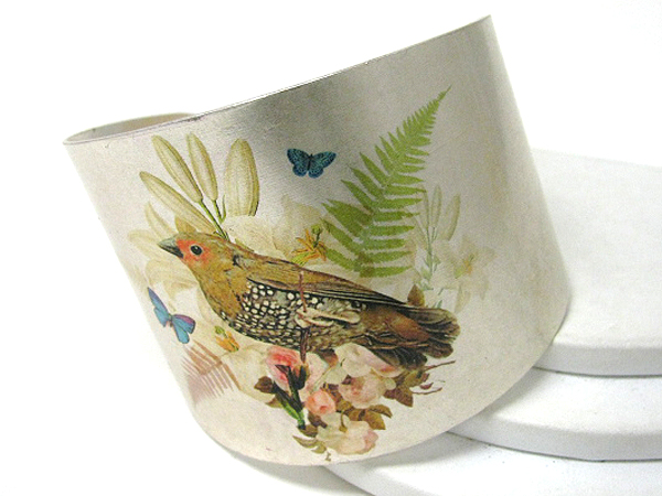 Antique style bird paint on a metal bracelet