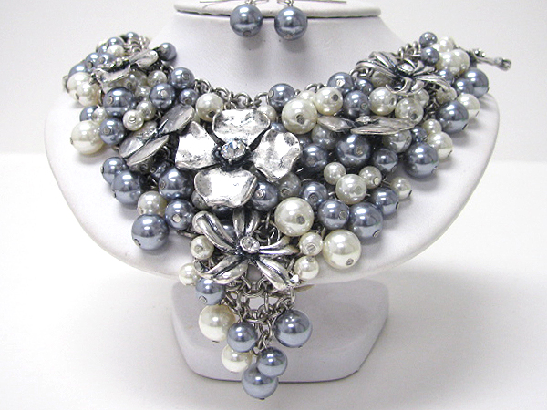 Crystal center metal flower and pearl covered bib necklace earring set