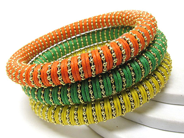 Multi row wood and small metal balls on fabric wrapped bangle set