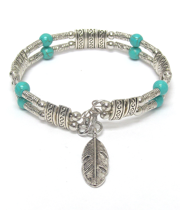 Feather charm and turquoise ball bracelet