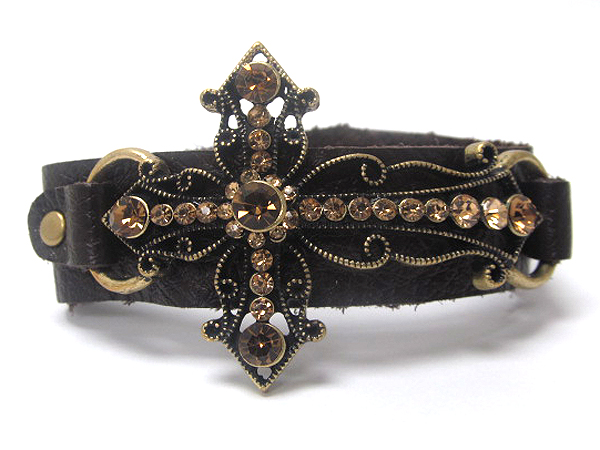 Multi crystal stud cross and leatherette button bracelet