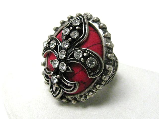 Retro vintage crystal fleur de lis on coral stone stretch ring?