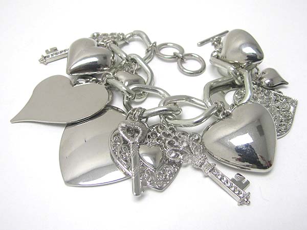 Multi textured and plain metal heart and key charm dangle bracelet