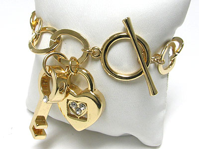 Metal thiick key and liock charm and round chain toggle bracelet