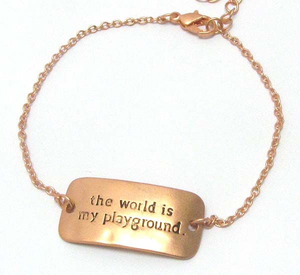 Message on hammered and curved metal plate bracelet - the world is my playground