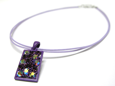 Crystal and enamel metal pendant cord necklace