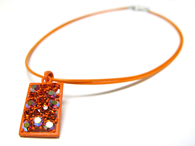 Crystal and enamel metal pendant cord necklace