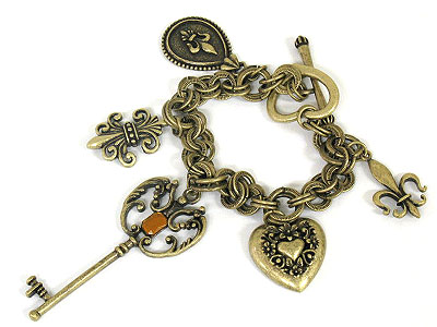 Antique gold key and heart and fluer de lis charm toggle bracelet