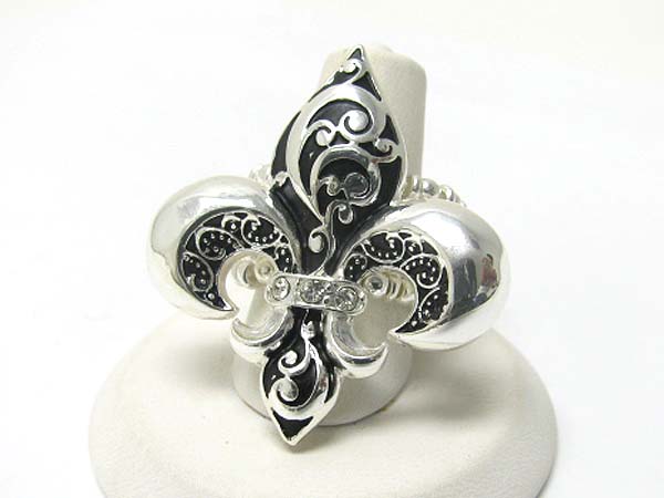 Crystal deco textured metal fleur de lis stretch ring