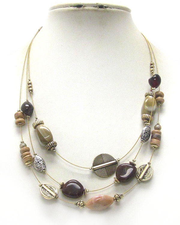 Multi material bead and wire illusion necklace