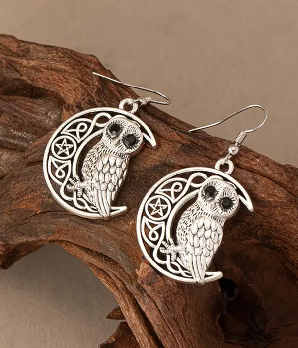 Metal filigree moon and owl earring