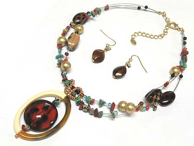 Glass oval pendant and patina and natural stone deco strands necklace and earring set 