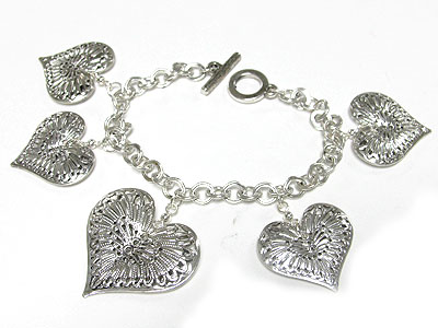 Metal filigree heart charms dangle toggle bracelet