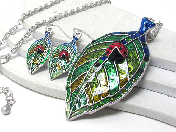 Crystal and epoxy deco ladybug on leaf necklace earring set